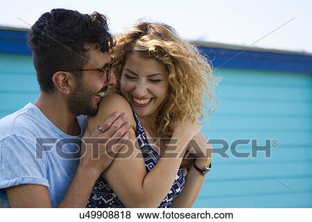 Stock Photo - Young couple laughing. Fotosearch