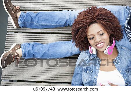 Young couple on jetty, overhead view View Large Photo Image Stock Image - Young couple on jetty, overhead view. Fotosearch