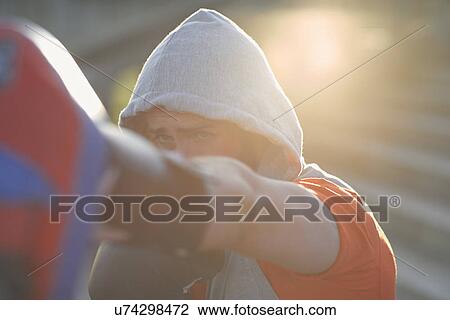 Stock Image - Young man boxing training. Fotosearch