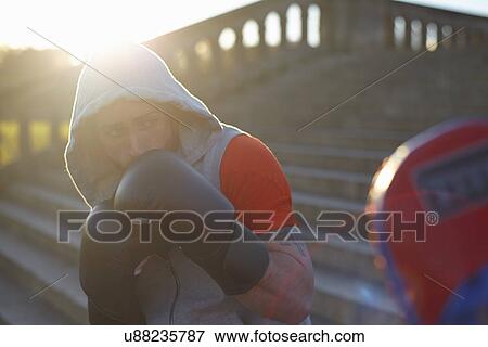 Stock Photo - Young man boxing training. Fotosearch