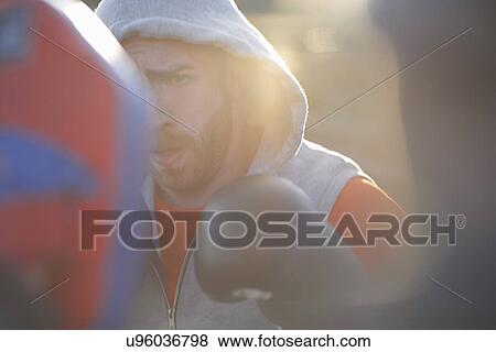 Young man boxing training View Large Photo Image Stock Photo - Young man boxing training. Fotosearch