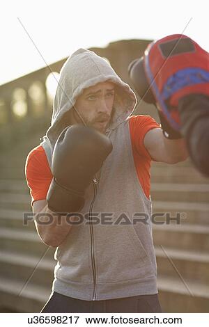 Young man boxing training with teacher View Large Photo Image Stock Photo - Young man boxing training with teacher. Fotosearch