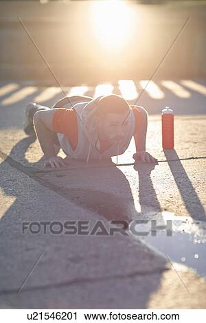 Young man doing push ups View Large Photo Image Stock Image - Young man doing push ups. Fotosearch