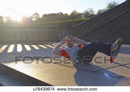 Young man doing sit ups View Large Photo Image Picture - Young man doing sit ups. Fotosearch
