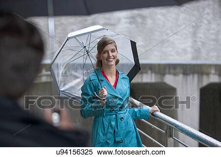 Young woman greeting mature man on footbridge View Large Photo Image Stock Photography - Young woman greeting mature man on footbridge. Fotosearch