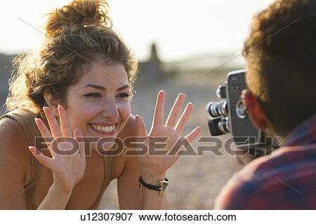 Young woman posing for boyfriend with vintage camera View Large Photo Image Stock Photo - Young woman posing for boyfriend with vintage camera. Fotosearch