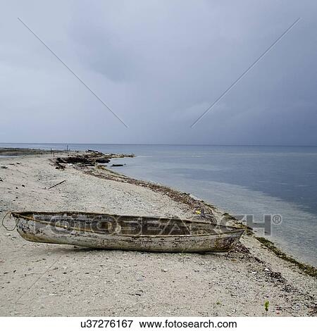 Abandoned boat on the beach, Utila, Bay Islands, Honduras View Large Photo Image Stock Photo - Abandoned boat on the beach, Utila, Bay Islands, Honduras. Fotosearch