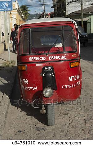 Auto rickshaw on a street, Barrio El Centro, Copan, Copan Ruinas, Honduras View Large Photo Image Stock Image - Auto rickshaw on a street, Barrio El Centro, Copan, Copan Ruinas, Honduras. Fotosearch
