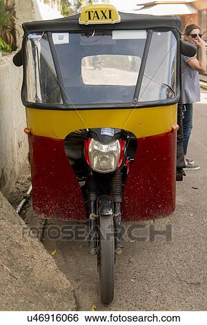Stock Photograph - Auto rickshaw on a street, Utila, Bay Islands, Honduras. Fotosearch