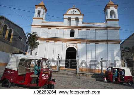 Picture - Auto rickshaws in front of a church, Barrio El Centro, Copan, Copan Ruinas, Honduras. Fotosearch