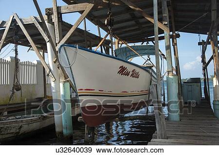 Boats at a dock, Cayman Cay, Utila Island, Bay Islands, Honduras View Large Photo Image Stock Photo - Boats at a dock, Cayman Cay, Utila Island, Bay Islands, Honduras. Fotosearch