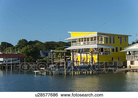 Buildings at the waterfront, Utila, Bay Islands, Honduras View Large Photo Image Stock Photograph - Buildings at the waterfront, Utila, Bay Islands, Honduras. Fotosearch
