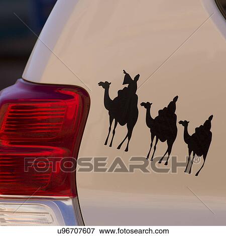 Stock Photo - Camel-riding painting on a car, Ouarzazate, Morocco. Fotosearch