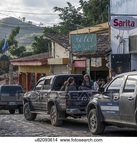 Picture - Cars on a street, Barrio El Centro, Copan, Copan Ruinas, Honduras. Fotosearch