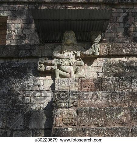 Carved figure at an archaeological site, Copan, Copan Ruinas, Copan Department, Honduras View Large Photo Image Stock Photo - Carved figure at an archaeological site, Copan, Copan Ruinas, Copan Department, Honduras. Fotosearch