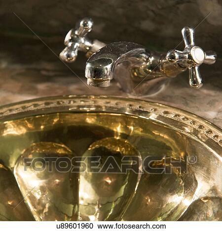 Stock Image - Close-up of bathroom sink in the La Sultana Hotel, Marrakesh, Morocco. Fotosearch