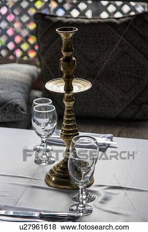 Close-up of candlestick holder with wineglasses on table, Medina, Marrakesh, Morocco View Large Photo Image Stock Photo - Close-up of candlestick holder with wineglasses on table, Medina, Marrakesh, Morocco. Fotosearch
