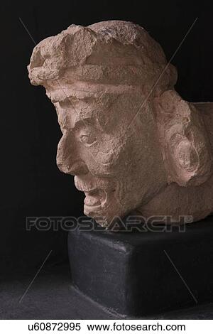 Stock Photography - Closeup of a Mayan clay statue in Mayan Sculpture Museum, Copan, Copan Ruinas, Copan Department, Honduras. Fotosearch