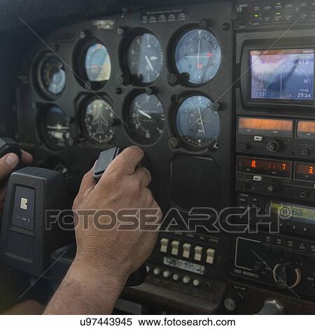 Closeup of a person's hand at control panel of a seaplane, Bay Islands, Honduras View Large Photo Image Stock Photography - Closeup of a person's hand at control panel of a seaplane, Bay Islands, Honduras. Fotosearch