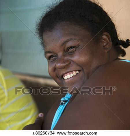 Closeup of a woman smiling, Cayman Cay, Utila Island, Bay Islands, Honduras View Large Photo Image Picture - Closeup of a woman smiling, Cayman Cay, Utila Island, Bay Islands, Honduras. Fotosearch