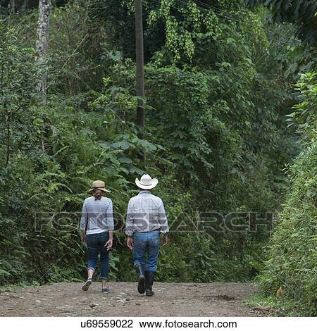 Couple walking on a pathway in forest, Finca El Cisne, Honduras View Large Photo Image Stock Image - Couple walking on a pathway in forest, Finca El Cisne, Honduras. Fotosearch