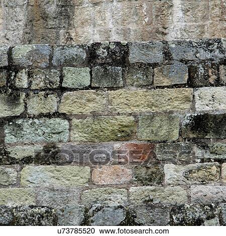 Stock Image - Detail of a stone wall at an archaeological site, Copan, Copan Ruinas, Copan Department, Honduras. Fotosearch