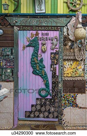 Detail of carving on the door of a bar, Jade Seahorse, Utila Island, Bay Islands, Honduras View Large Photo Image Stock Image - Detail of carving on the door of a bar, Jade Seahorse, Utila Island, Bay Islands, Honduras. Fotosearch