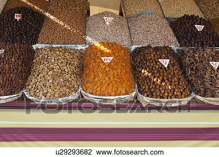 Stock Image - Dried food and spices for sale at a market stall, Marrakesh, Morocco. Fotosearch