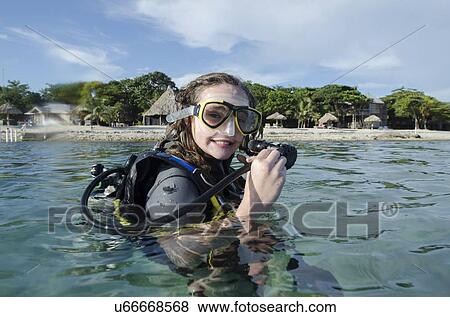 Stock Photo - Female scuba diver in the sea, Utila, Bay Islands, Honduras. Fotosearch