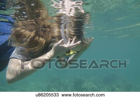 Female scuba diver in the sea, Utopia Village, Utila, Bay Islands, Honduras View Large Photo Image Stock Image - Female scuba diver in the sea, Utopia Village, Utila, Bay Islands, Honduras. Fotosearch