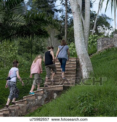 Female tourists moving up on staircase, Finca Santa Isabel, Copan Ruinas, Honduras View Large Photo Image Stock Photo - Female tourists moving up on staircase, Finca Santa Isabel, Copan Ruinas, Honduras. Fotosearch