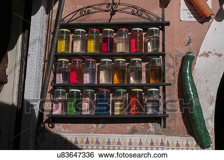 Stock Photograph - Glass jars filled with colorful liquid, Marrakesh, Morocco. Fotosearch