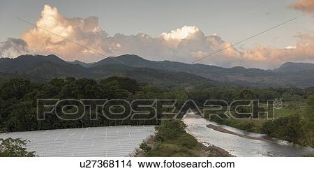 Picture - High angle view of a river in the valley, Copan, Copan Ruinas, Honduras. Fotosearch