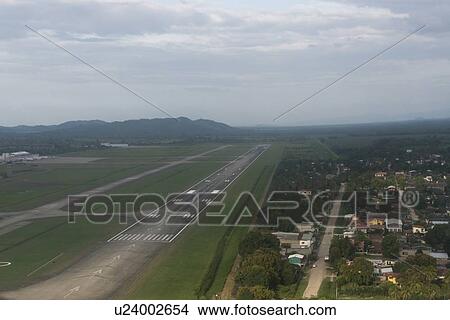 Picture - High angle view of the runway at an airport, Bay Islands, Honduras. Fotosearch