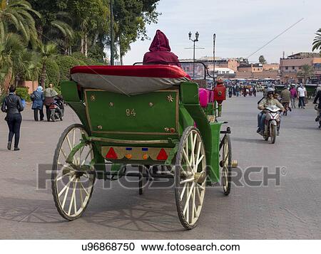 Stock Image - Horsedrawn carriage on the road, Marrakesh, Morocco. Fotosearch