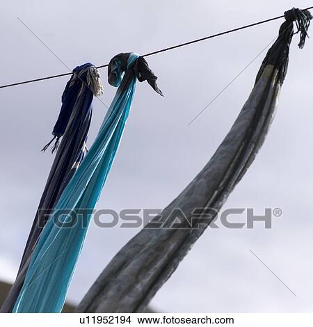 Picture - Low angle view of hanging stoles, Morocco. Fotosearch