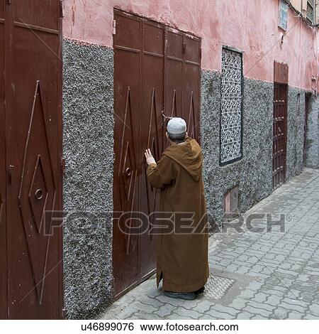 Man knocking at door, Medina, Marrakesh, Morocco View Large Photo Image Stock Photograph - Man knocking at door, Medina, Marrakesh, Morocco. Fotosearch