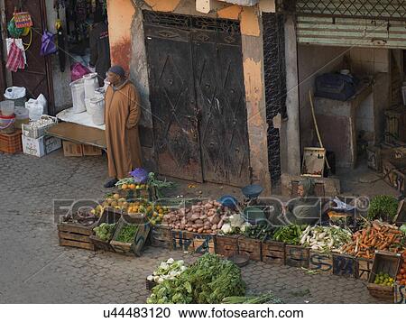 Man selling fruits and vegetables on the street, Marrakesh, Morocco View Large Photo Image Stock Image - Man selling fruits and vegetables on the street, Marrakesh, Morocco. Fotosearch