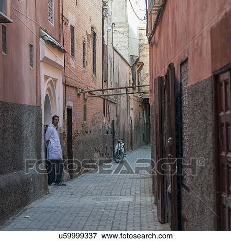 Stock Photo - Man standing on the street, Marrakesh, Morocco. Fotosearch