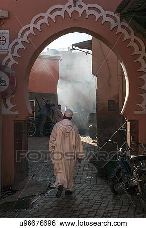 Man walking in an alley, Marrakesh, Morocco View Large Photo Image Stock Photograph - Man walking in an alley, Marrakesh, Morocco. Fotosearch