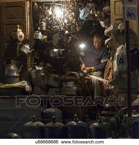 Stock Photograph - Man working in his workshop, Marrakesh, Morocco. Fotosearch