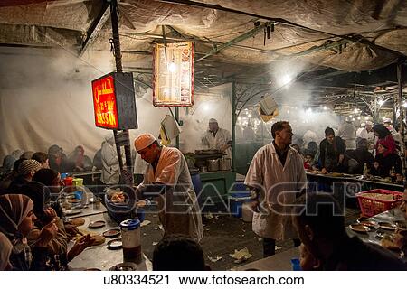 People having food in a restaurant, Djemma El Fna, Marrakesh, Morocco View Large Photo Image Stock Image - People having food in a restaurant, Djemma El Fna, Marrakesh, Morocco. Fotosearch