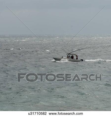 Stock Image - People on boat in the sea, Utila, Bay Islands, Honduras. Fotosearch