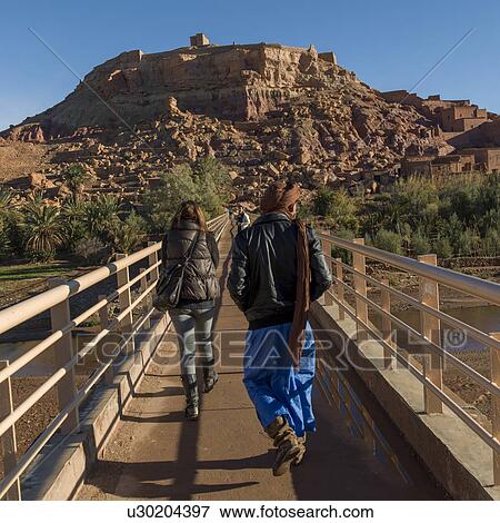 Stock Photo - People walking on a bridge, Ait Benhaddou, Ouarzazate, Souss-Massa-Draa, Morocco. Fotosearch