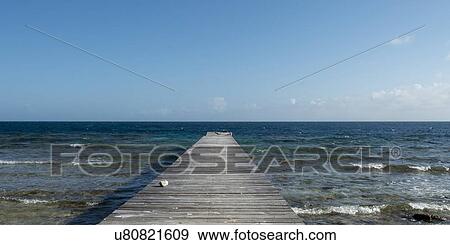 Pier on the beach, Utila, Bay Islands, Honduras View Large Photo Image Stock Photo - Pier on the beach, Utila, Bay Islands, Honduras. Fotosearch