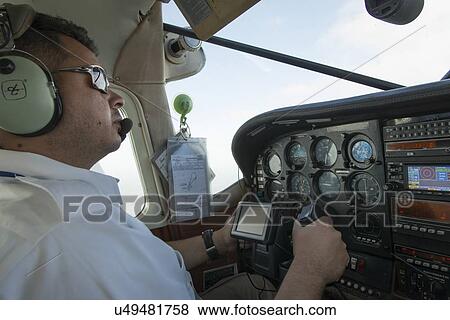Pilot flying a seaplane, Bay Islands, Honduras View Large Photo Image Stock Photo - Pilot flying a seaplane, Bay Islands, Honduras. Fotosearch