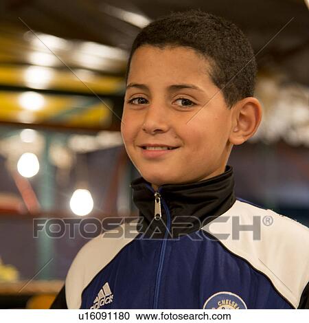 Portrait of a boy smiling, Marrakesh, Morocco View Large Photo Image Stock Image - Portrait of a boy smiling, Marrakesh, Morocco. Fotosearch
