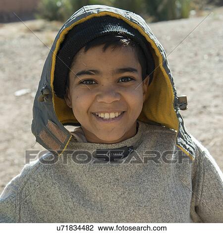 Stock Image - Portrait of a boy smiling, Tabounte, Ouarzazate Province, Souss-Massa-Draa, Morocco. Fotosearch