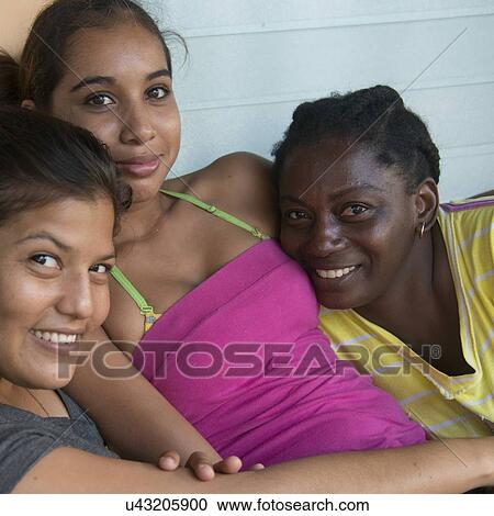 Portrait of female friends smiling, Cayman Cay, Utila Island, Bay Islands, Honduras View Large Photo Image Stock Image - Portrait of female friends smiling, Cayman Cay, Utila Island, Bay Islands, Honduras. Fotosearch