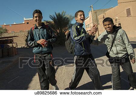 Stock Photograph - Portrait of schoolboys enjoying on the street, Tabounte, Ouarzazate Province, Souss-Massa-Draa, Morocco. Fotosearch